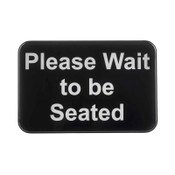 "Please Wait to be Seated" sign